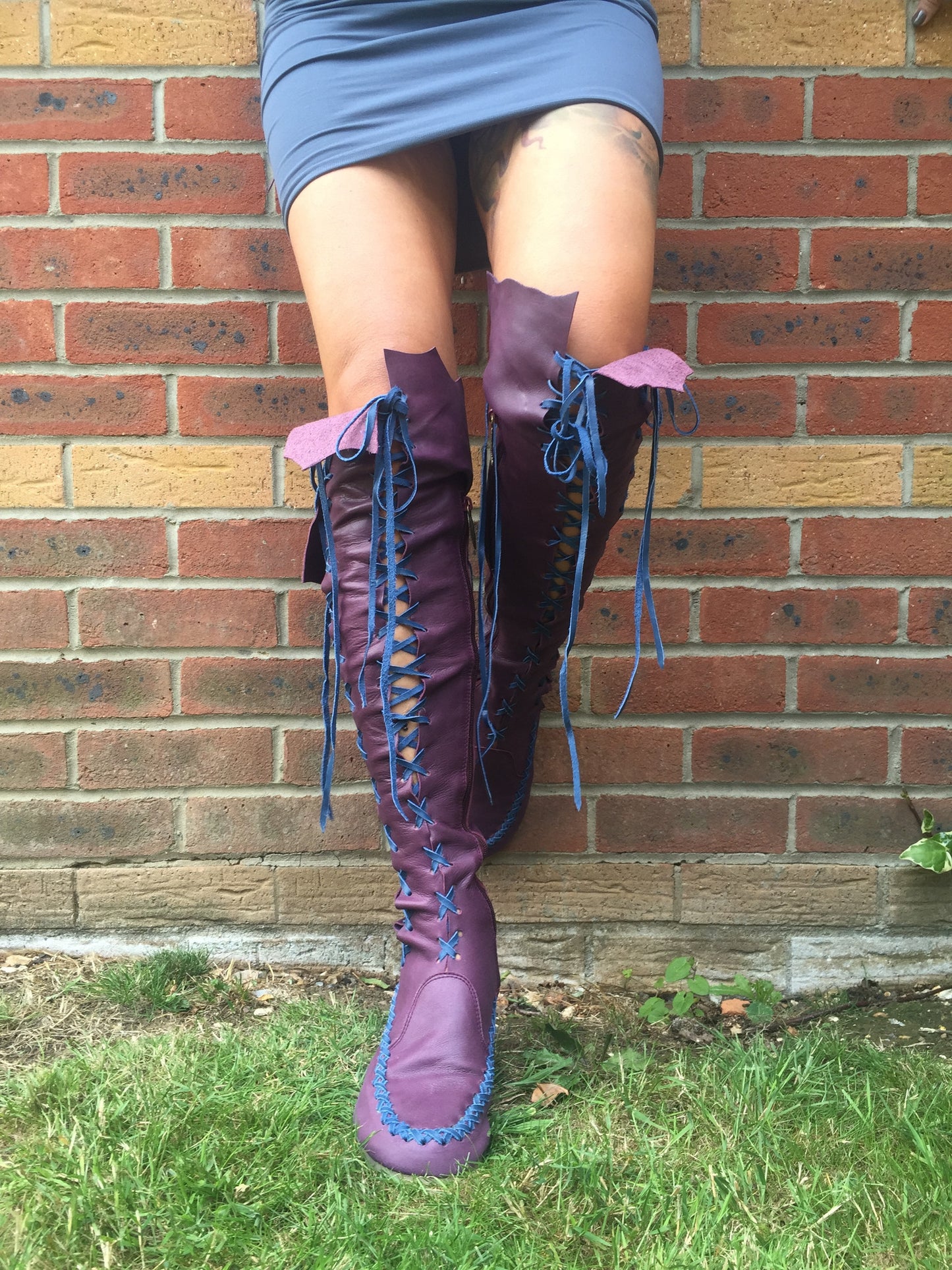 Plum knee high boots with cobalt laces