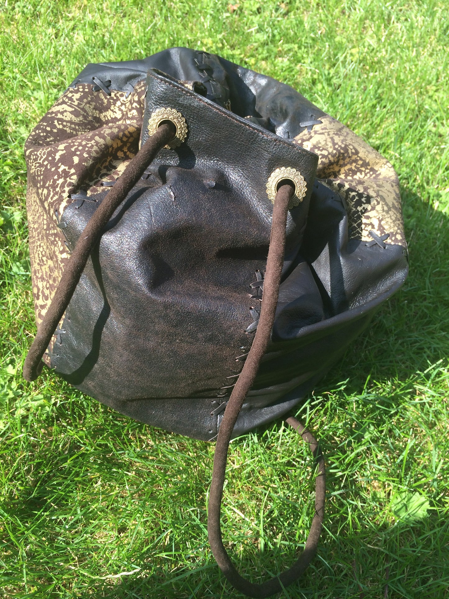 Serpent print Leather String Hand Bag and Rucksack