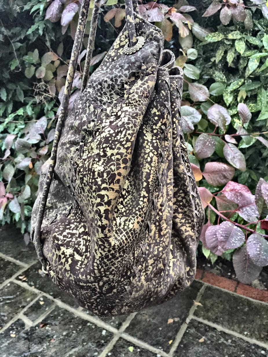 Serpent print hand bag