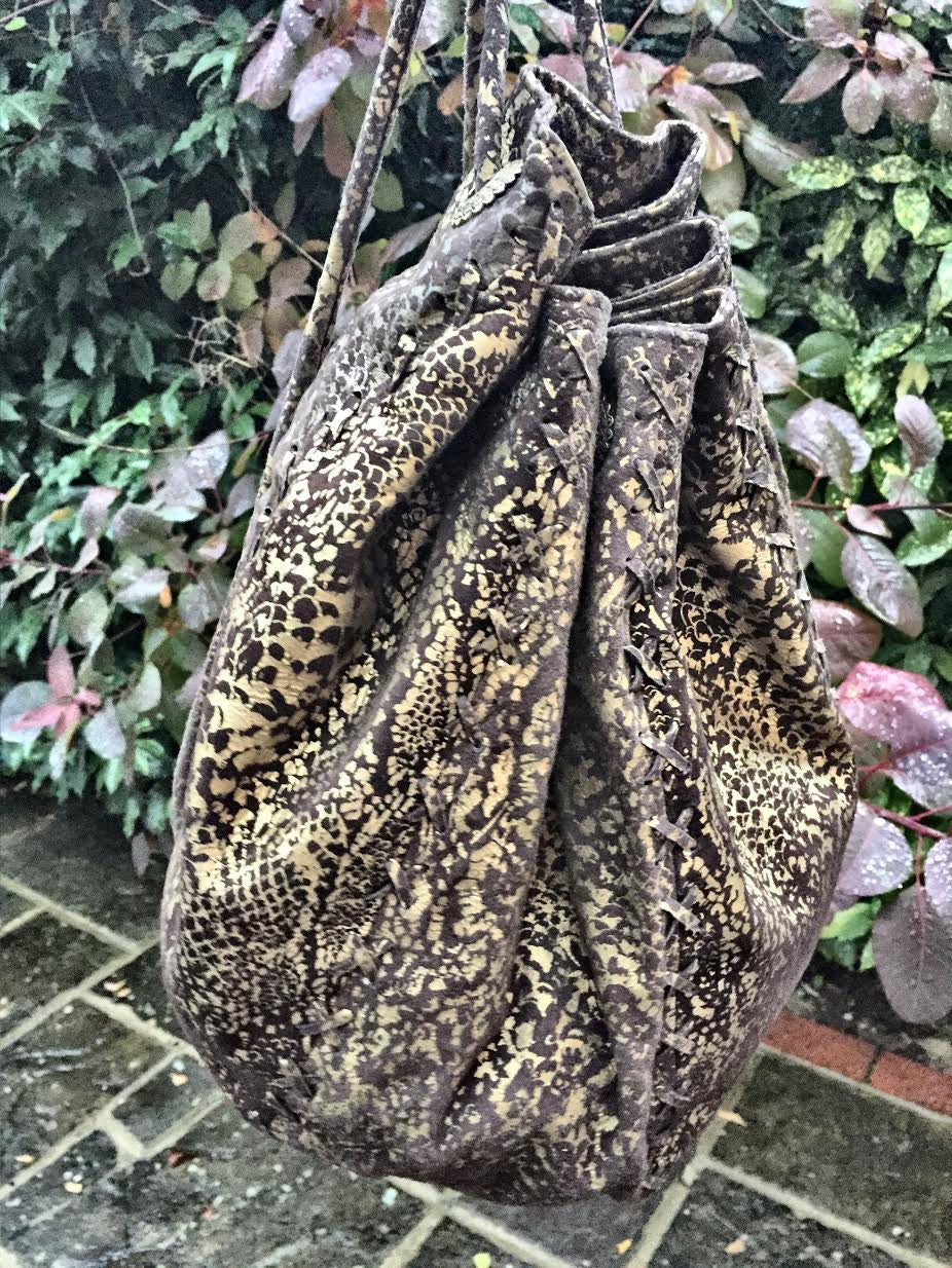 Serpent print hand bag