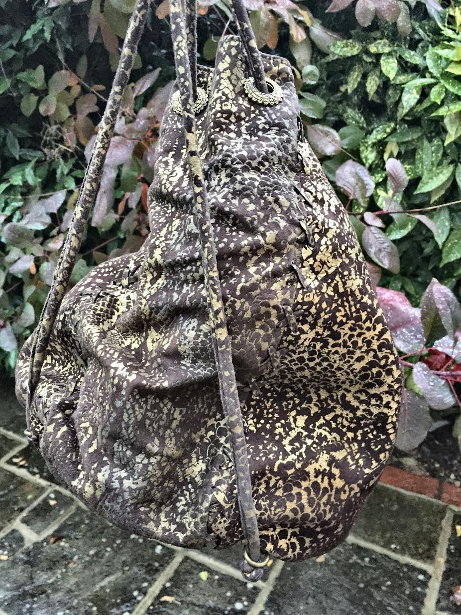 Serpent print hand bag