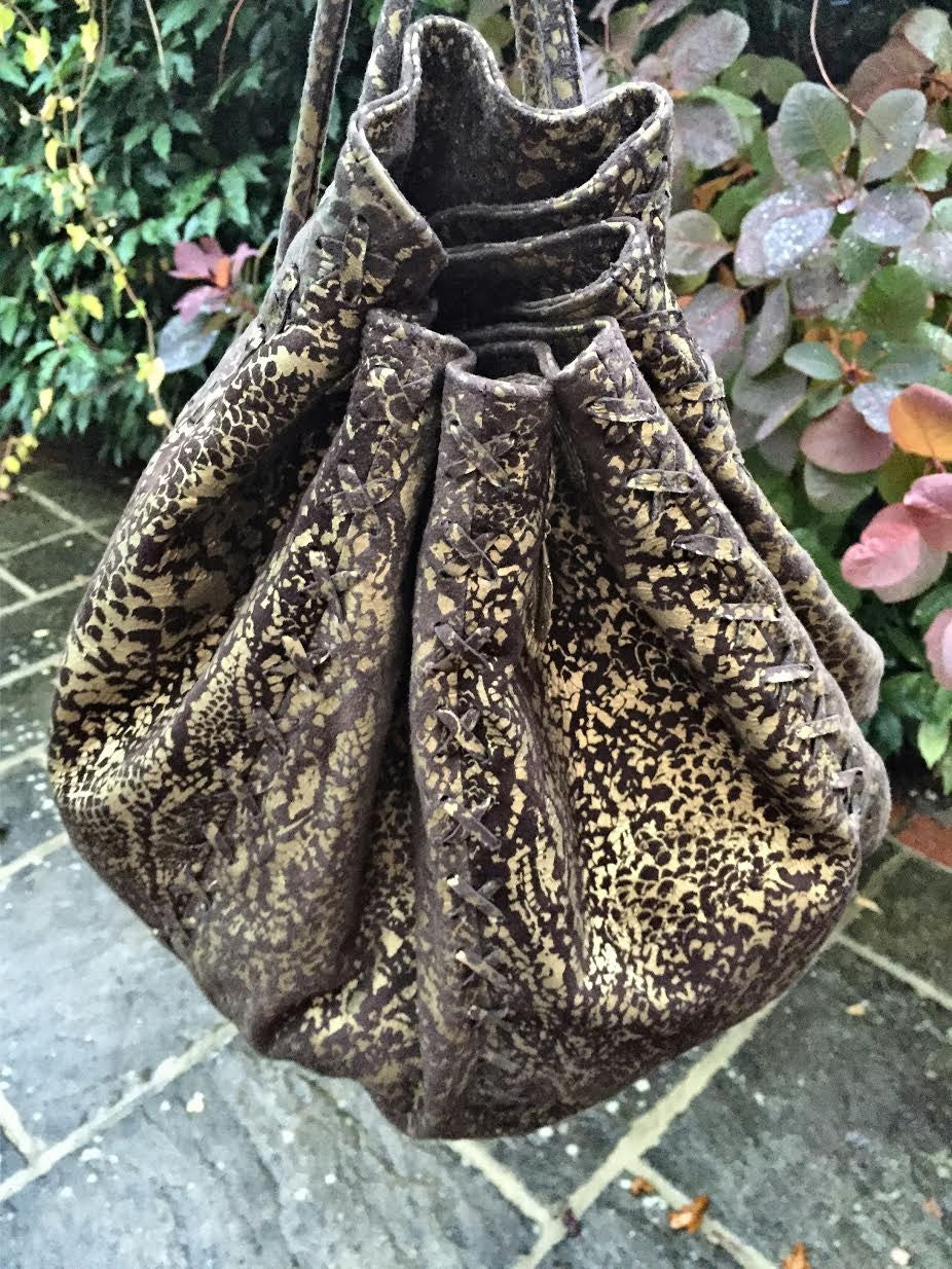 Serpent print hand bag