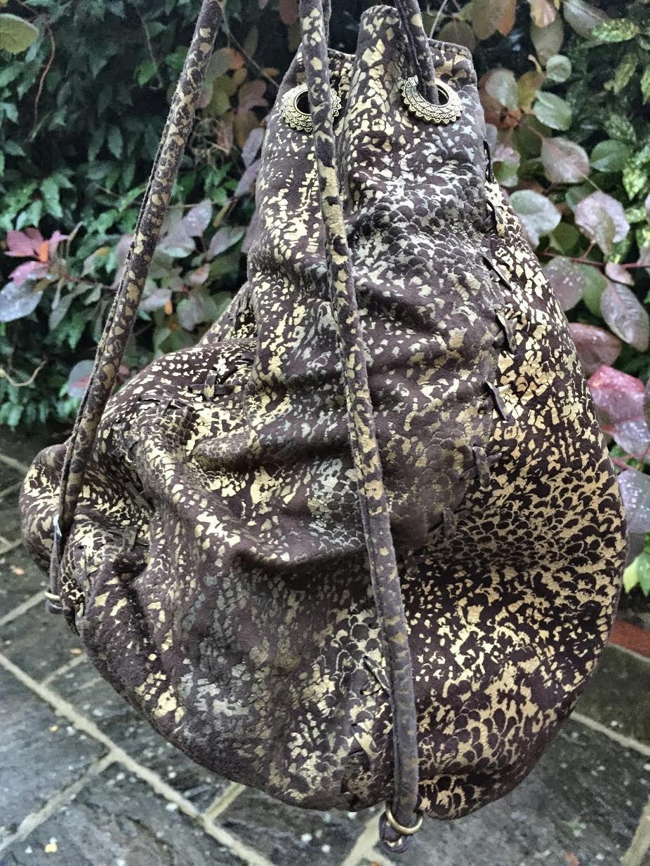 Serpent print hand bag