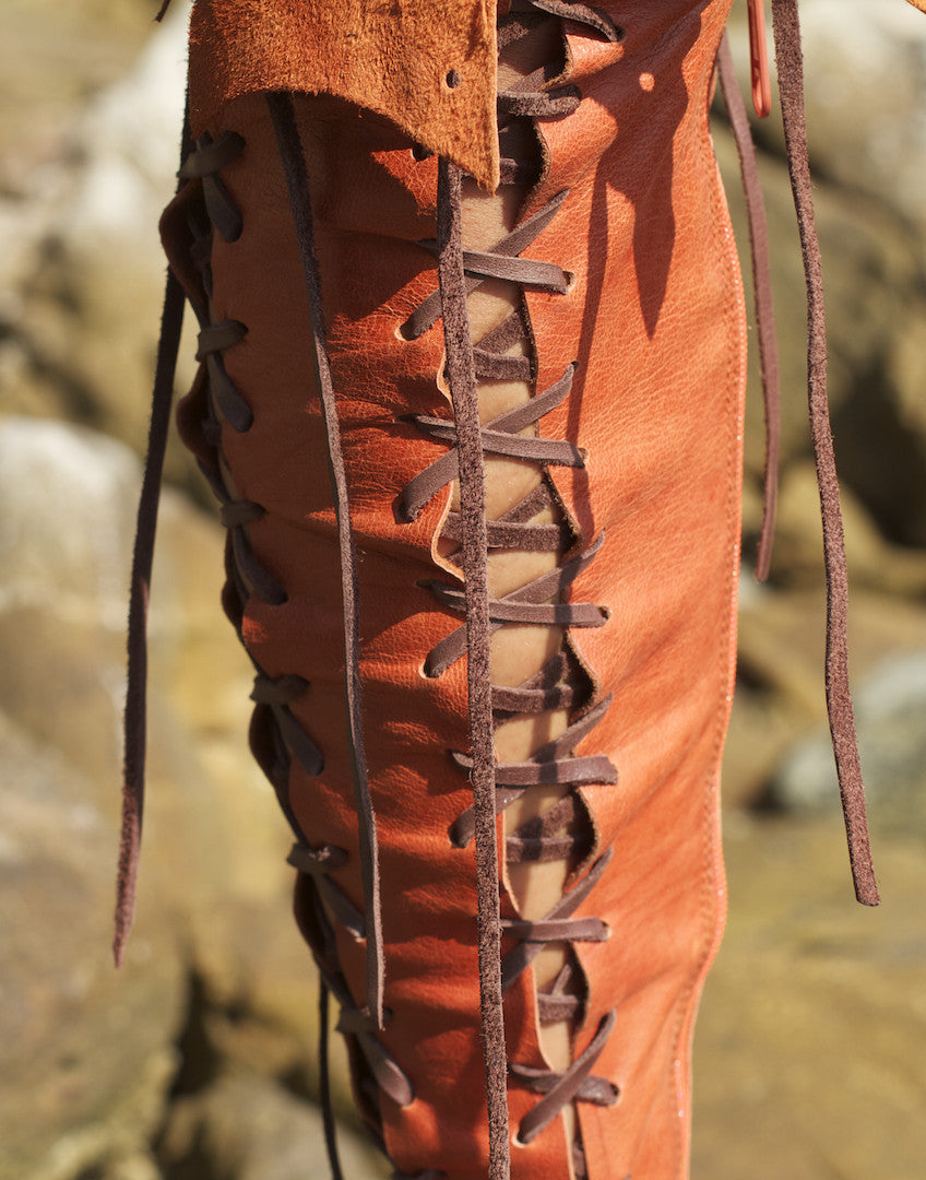 Orange knee high leather boots for women